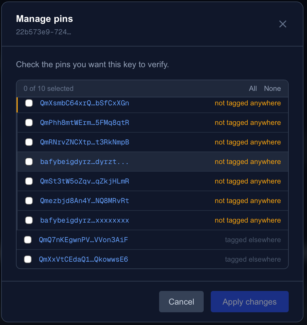 The Manage pins modal: a checklist of pinned CIDs, each marked 'not tagged anywhere' or 'tagged elsewhere', with Cancel and Apply changes buttons
